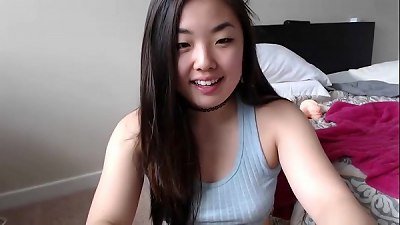super-cute asian girl plays with her coochie